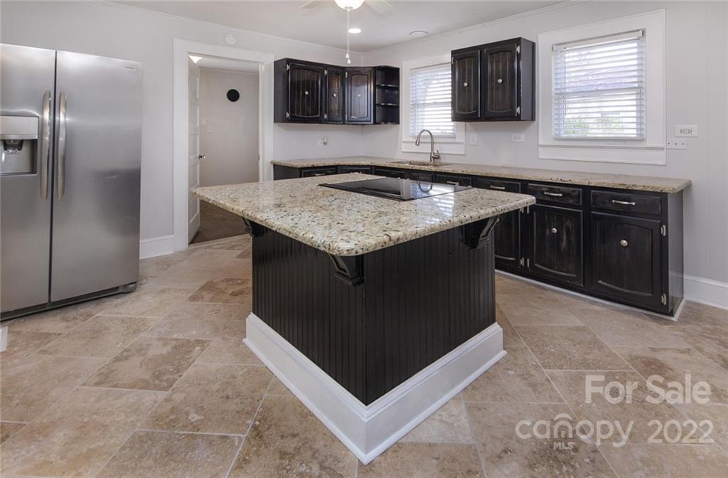 6910 Hickory Ridge Road Harrisburg, NC 28075 - Photo 8 of 21 a kitchen with stainless steel appliances granite countertop a refrigerator and a sink