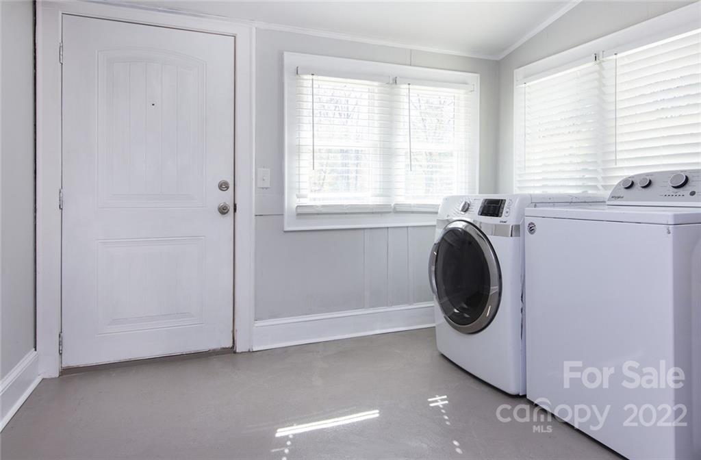 6910 Hickory Ridge Road Harrisburg, NC 28075 - Photo 9 of 21 a utility room with dryer and washer