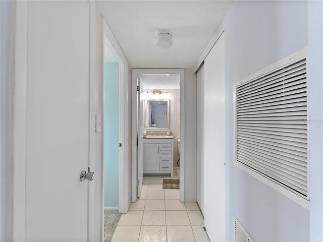 a bathroom with a granite countertop sink toilet a mirror a vanity and shower