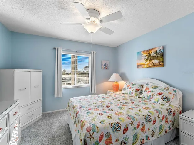 a bathroom with a granite countertop sink toilet a mirror a vanity and shower