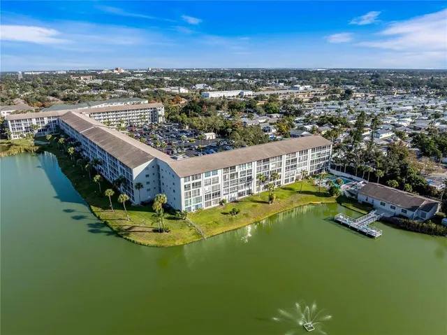 an aerial view of a house with a lake view