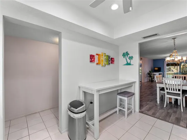 a kitchen with cabinets stainless steel appliances and a counter space