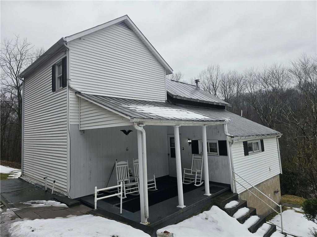 377 Crabapple Road Smock, PA 15480 - Photo 11 of 11 a view of a house with backyard and porch