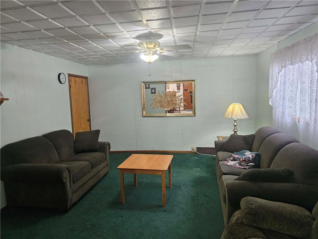 377 Crabapple Road Smock, PA 15480 - Photo 2 of 11 a living room with furniture and wall paintings