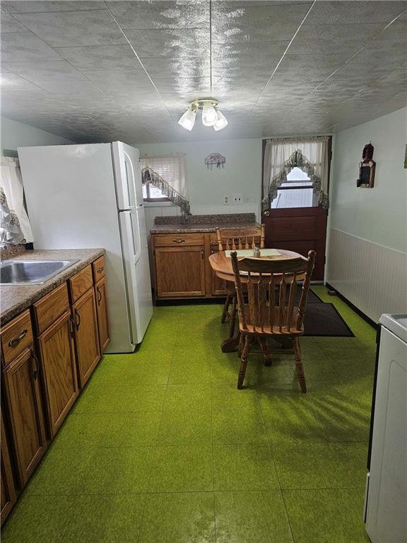 377 Crabapple Road Smock, PA 15480 - Photo 6 of 11 a dining room with furniture and a chandelier