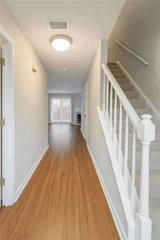 a view of entryway with wooden floor