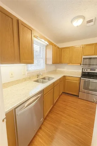 a kitchen with a sink and cabinets