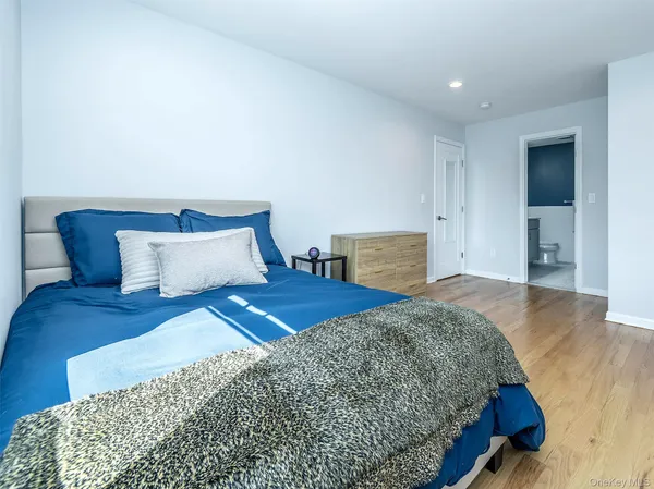 a bedroom with bed and window