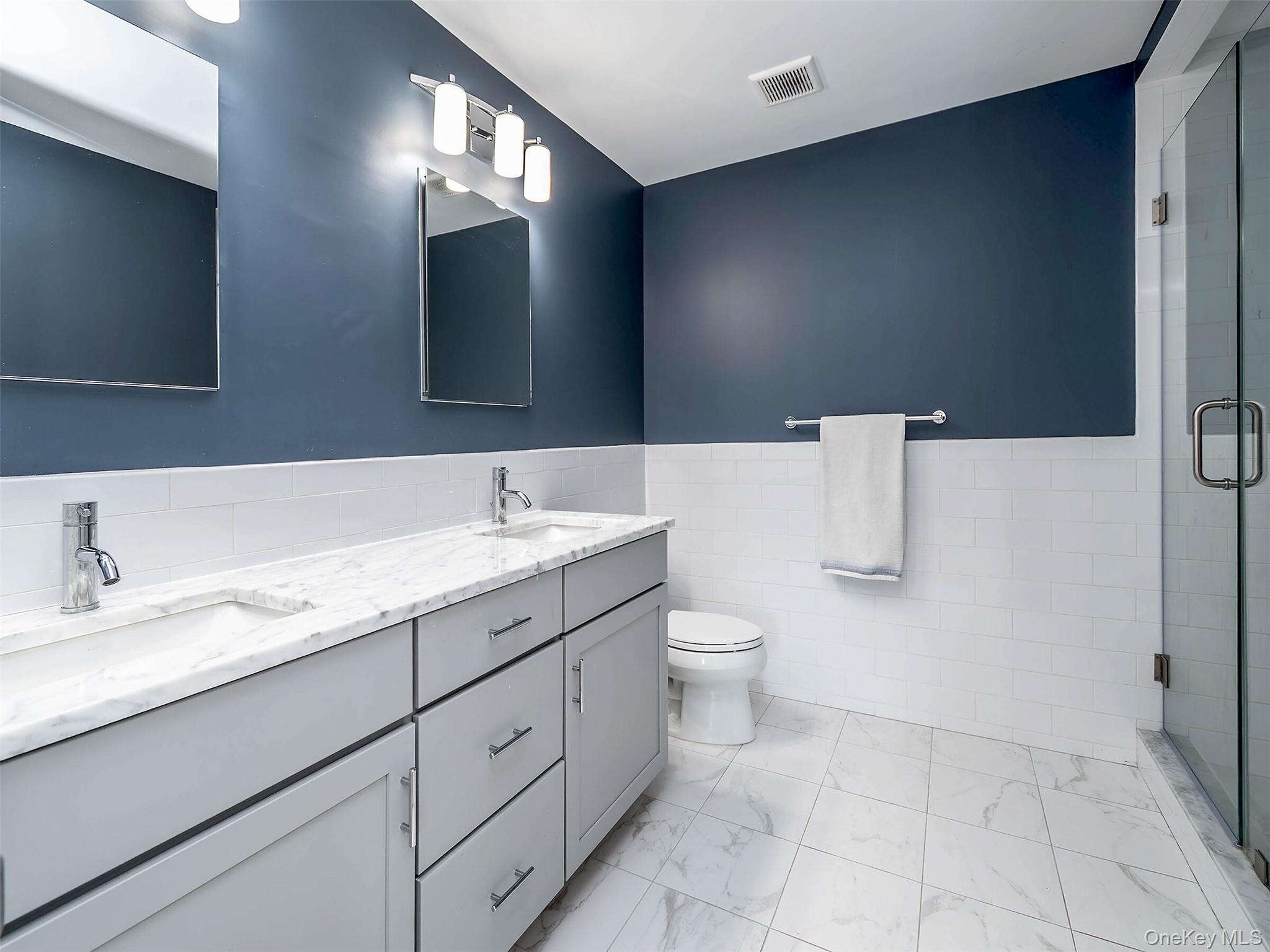17 Winans Place Locust Valley, NY 11560 - Photo 19 of 34 a bathroom with a sink and a mirror
