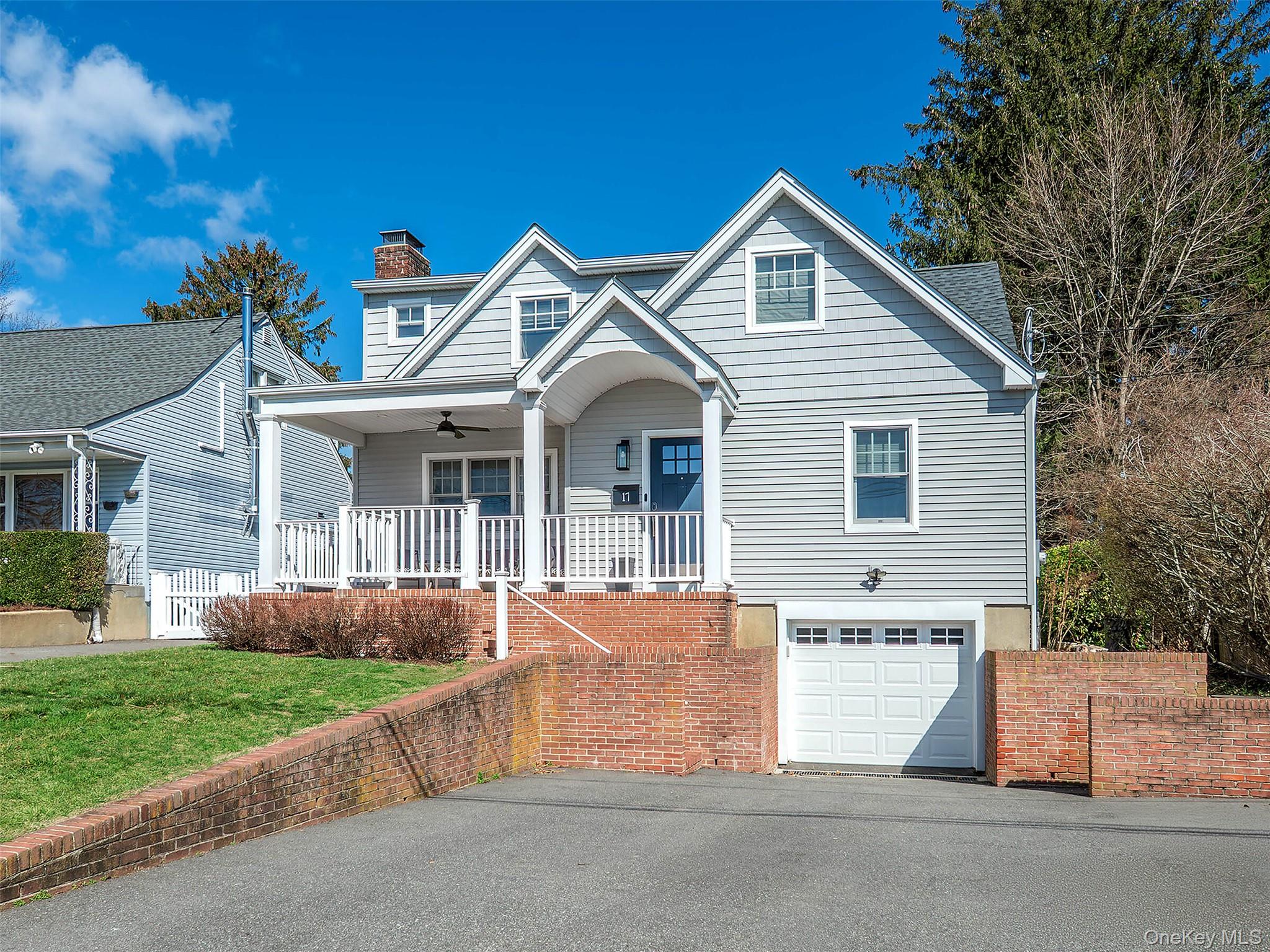 17 Winans Place Locust Valley, NY 11560 - Photo 2 of 34 front view of house with a yard