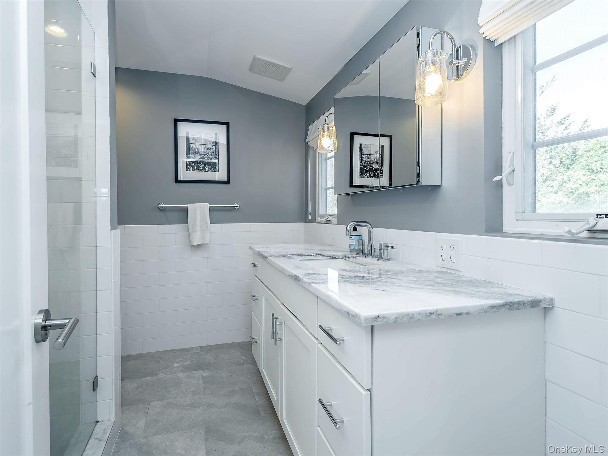 17 Winans Place Locust Valley, NY 11560 - Photo 24 of 34 a bathroom with a sink and a mirror