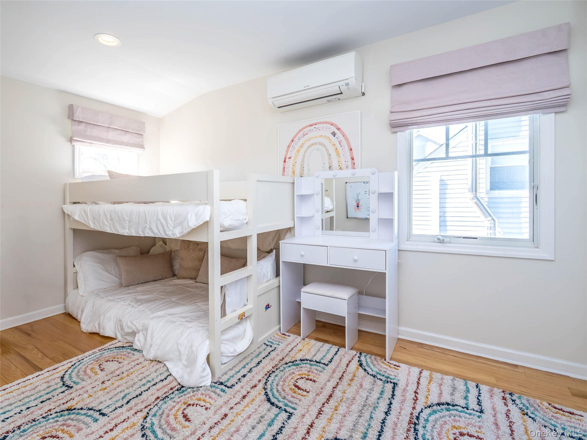 17 Winans Place Locust Valley, NY 11560 - Photo 25 of 34 a bedroom with a bed and a window