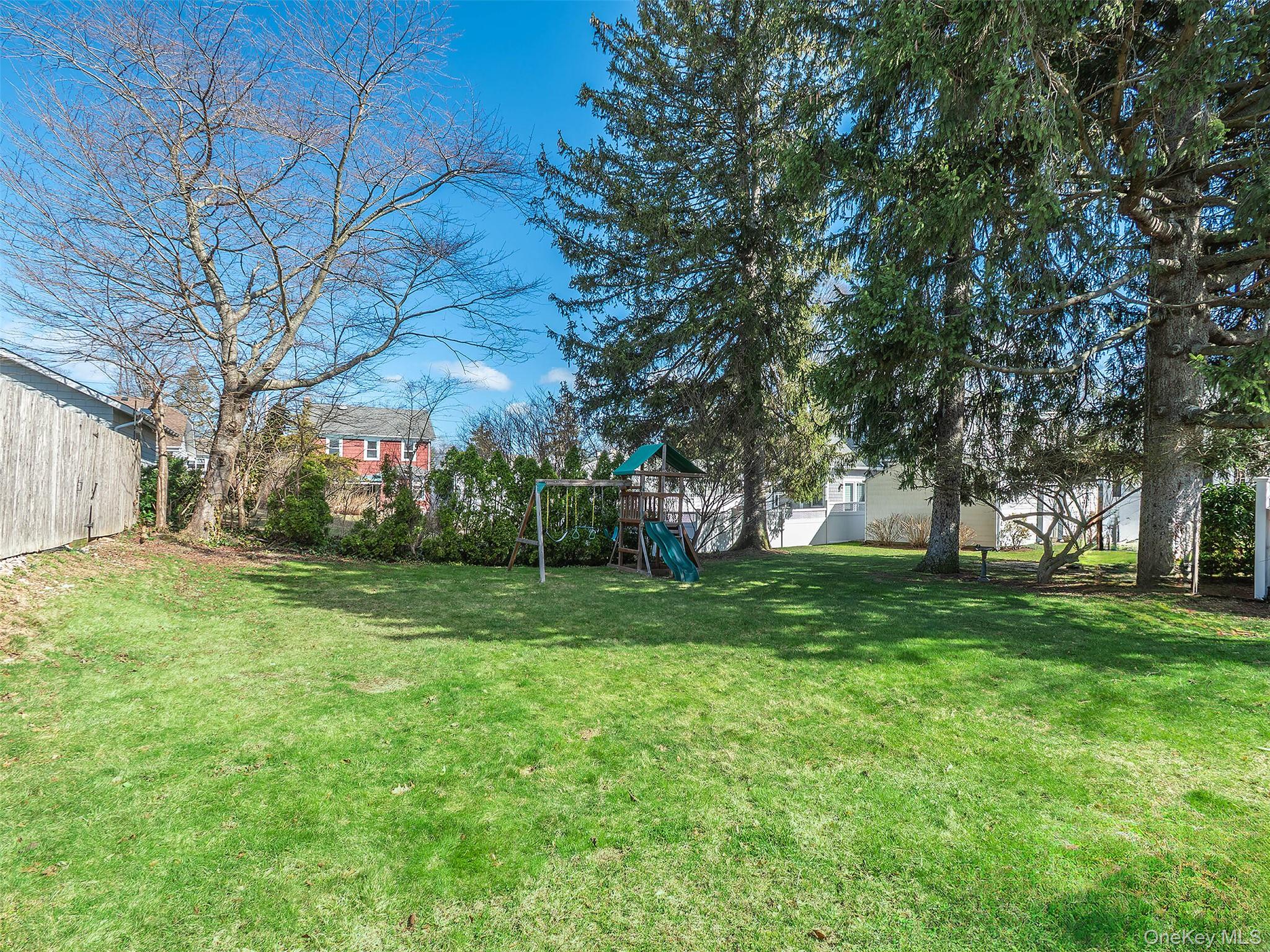 17 Winans Place Locust Valley, NY 11560 - Photo 34 of 34 a view of a backyard with large trees
