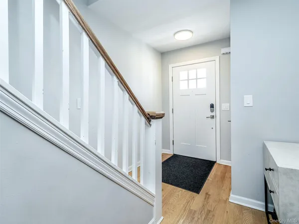 a view of staircase with wooden floor and stairs