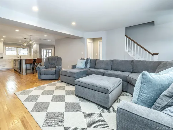 a living room with furniture and a rug
