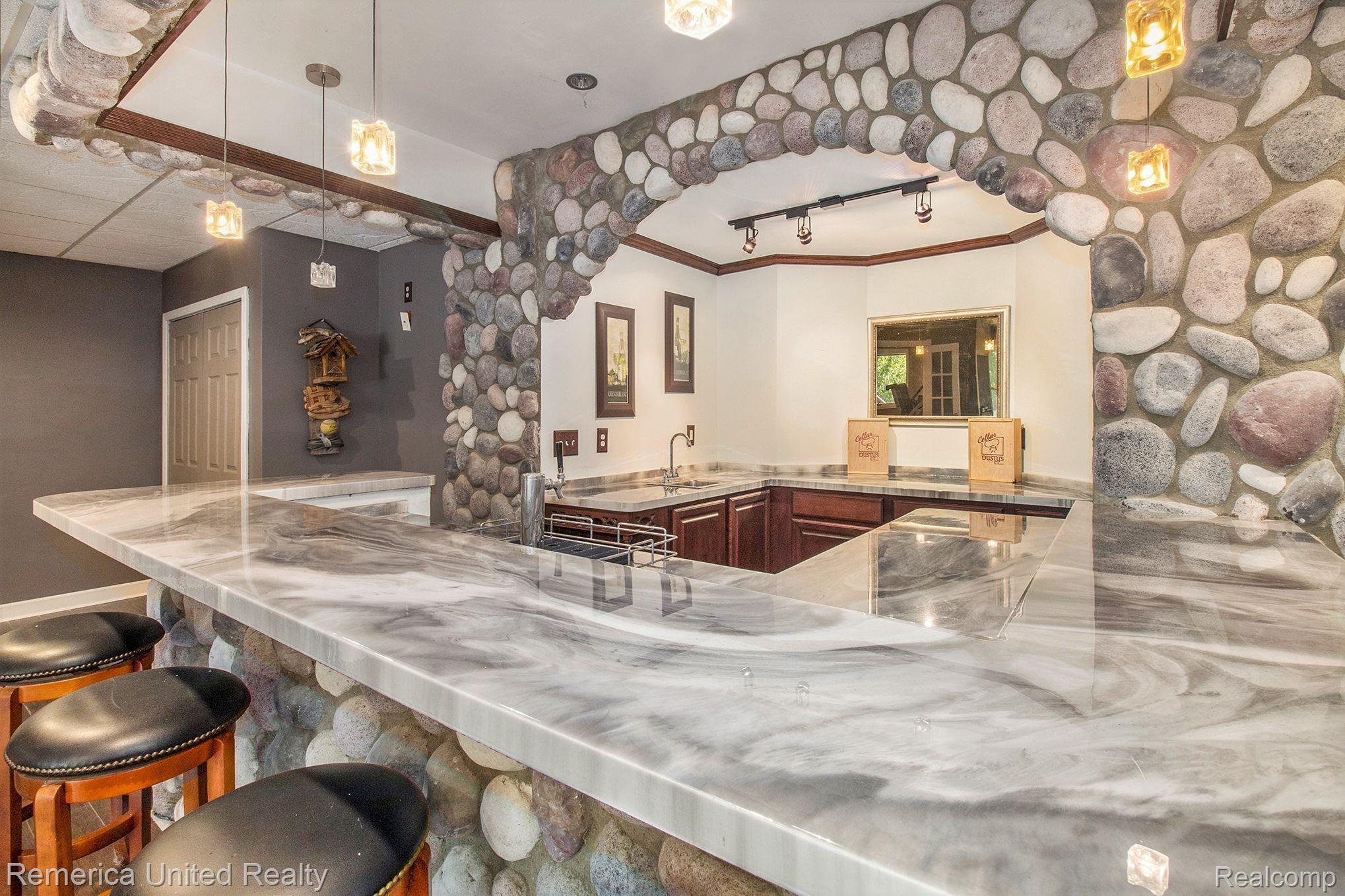 3470 East Highland Road Howell, MI 48843 - Photo 52 of 66 Stone Bar w/Beer Tap & Epoxy Counterop