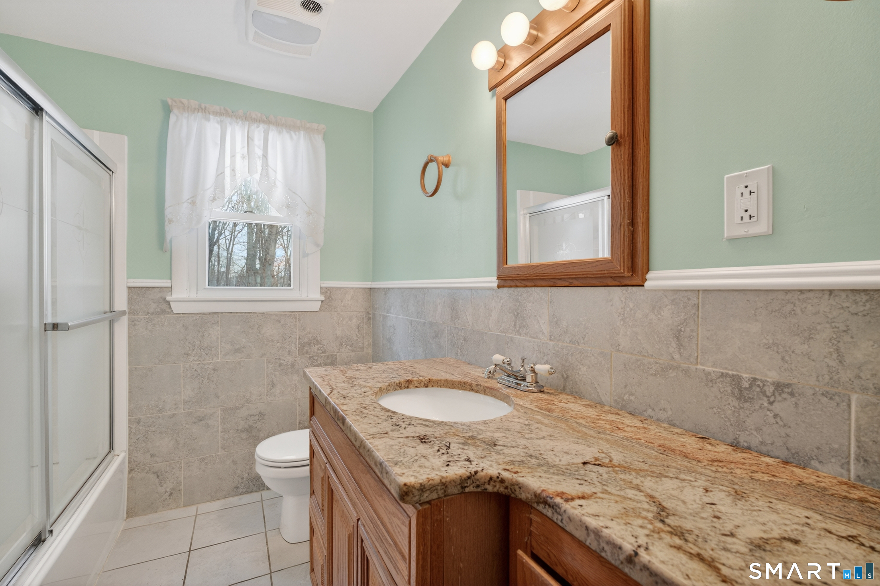 40 Quincy Lane Newington, CT 06111 - Photo 13 of 25 a bathroom with a granite countertop sink toilet and shower