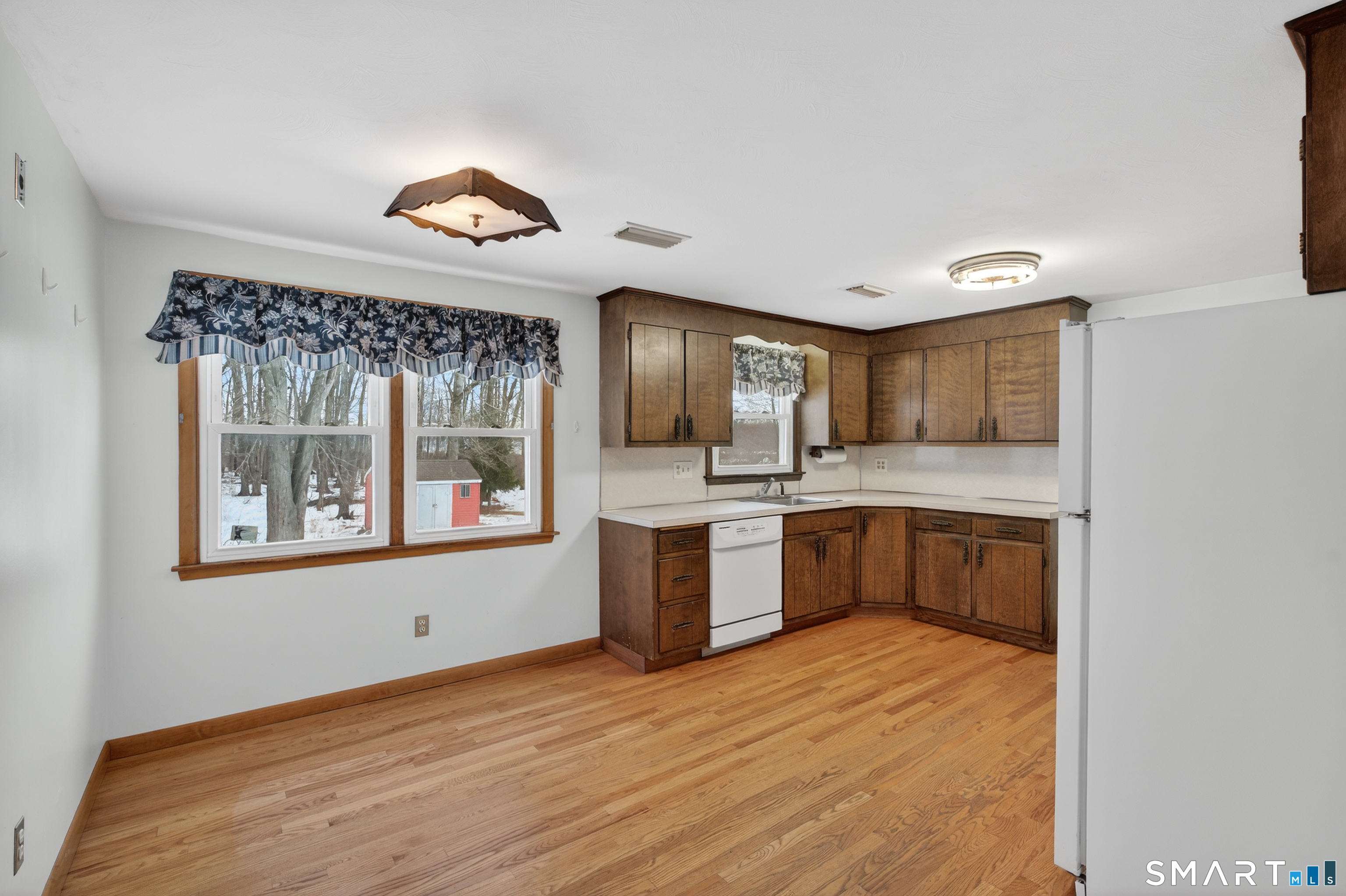 40 Quincy Lane Newington, CT 06111 - Photo 6 of 25 a kitchen with stainless steel appliances granite countertop a stove a sink and a refrigerator