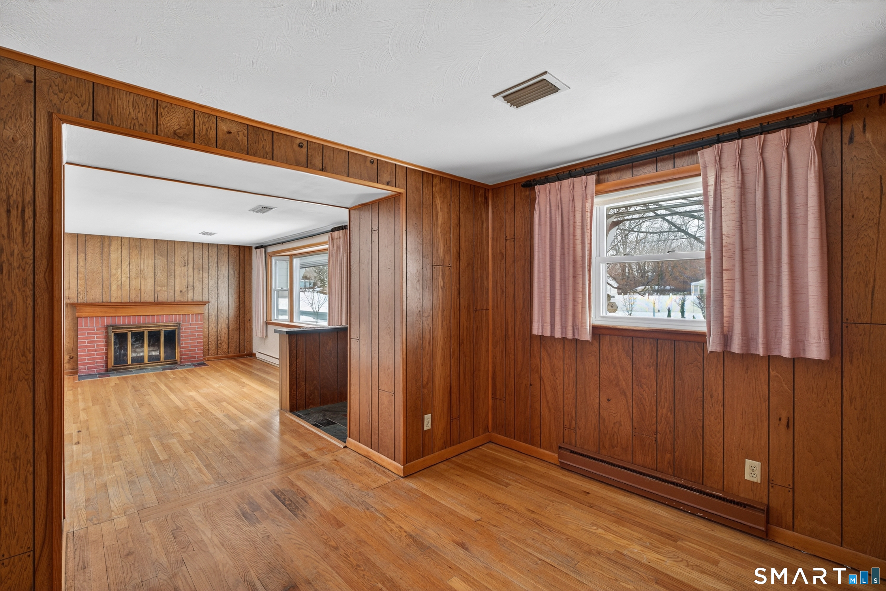 40 Quincy Lane Newington, CT 06111 - Photo 9 of 25 a view of an empty room with wooden floor and a window
