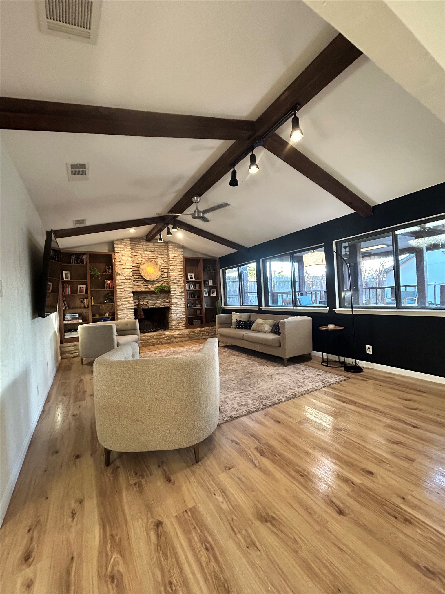 a living room with furniture and a large window