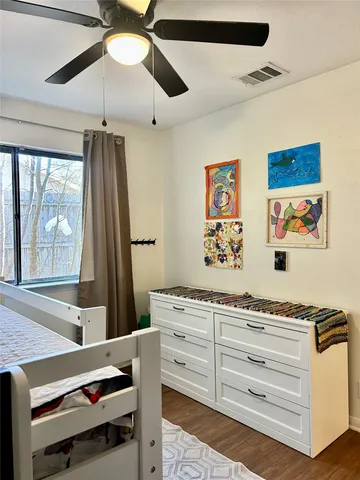 a living room with couch and a large window