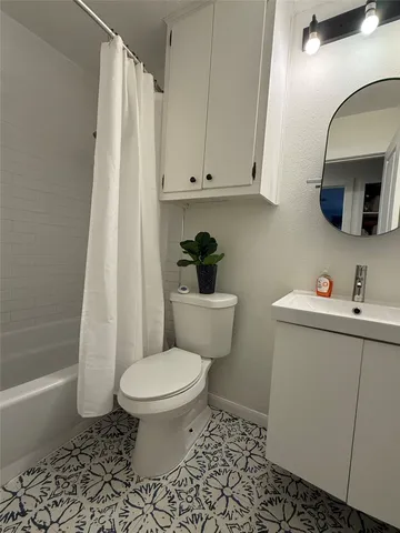a bathroom with a sink a vanity and a mirror
