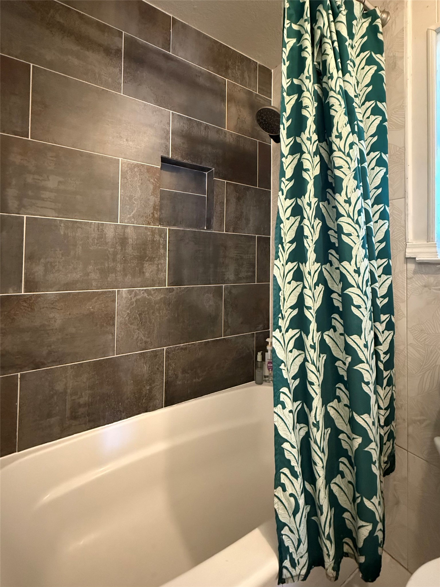 9507 Sherbrooke Street Austin, TX 78729 - Photo 19 of 29 a bathroom with a bathtub and shower