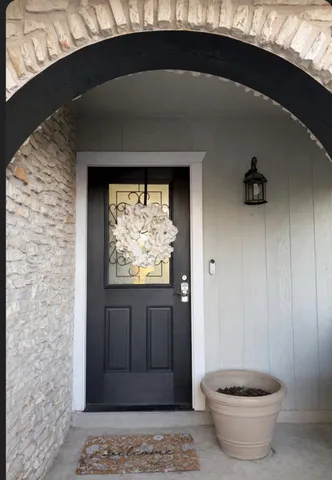 an aerial view of a houses with street