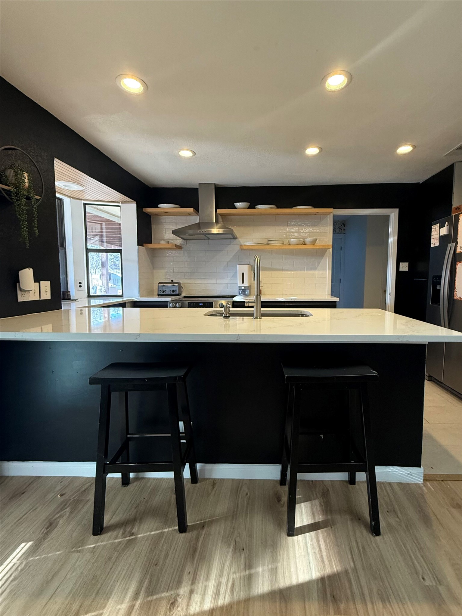 9507 Sherbrooke Street Austin, TX 78729 - Photo 6 of 29 a kitchen with a table and chairs in it