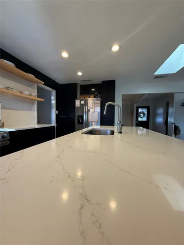 a large white room with large mirror