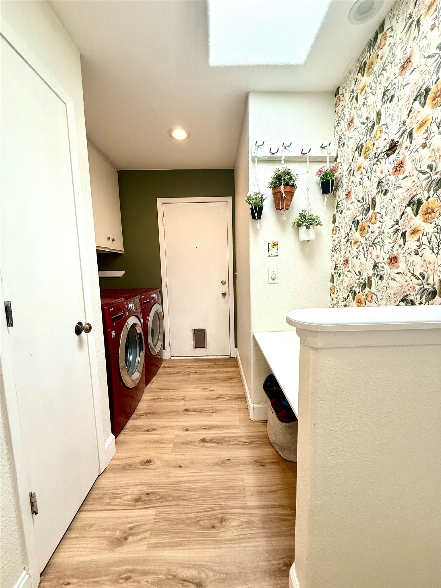 9507 Sherbrooke Street Austin, TX 78729 - Photo 10 of 29 a view of a hallway that has a washer and dryer