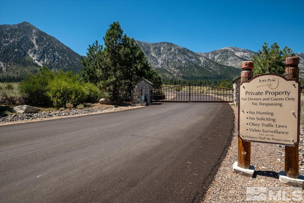 87 Five Creek Road Gardnerville, NV 89460 - Photo 3 of 40 a view of a pathway of a building with a road