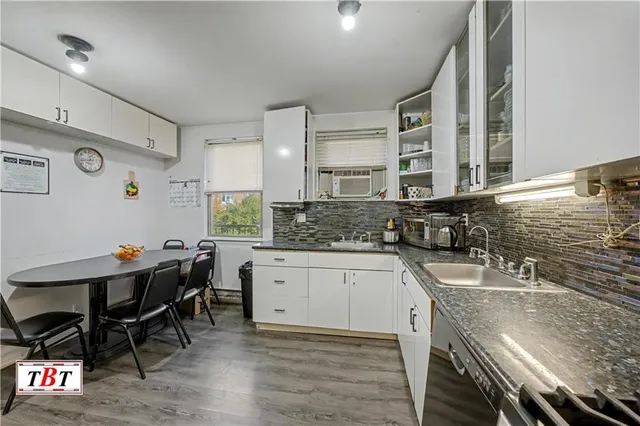 a kitchen with stainless steel appliances granite countertop a sink and cabinets