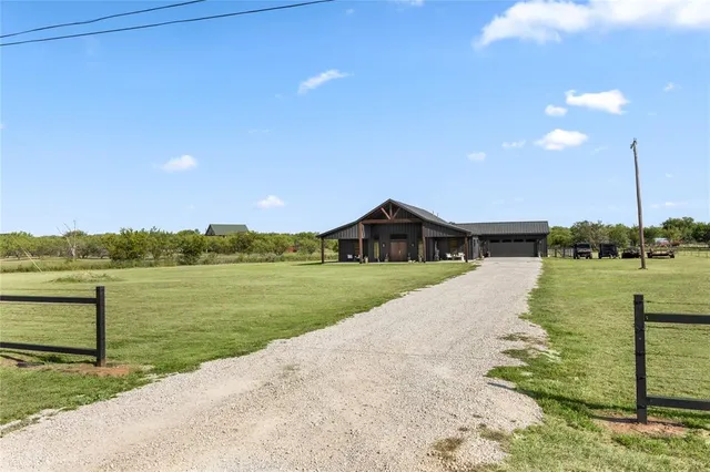 a view of a lake with a house in the background