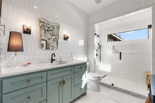 an aerial view of a residential houses with outdoor space