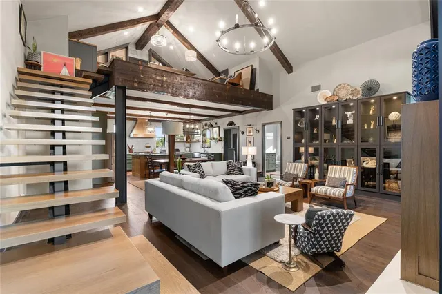 a dining hall with granite countertop a stove top oven a granite counter space and dining table