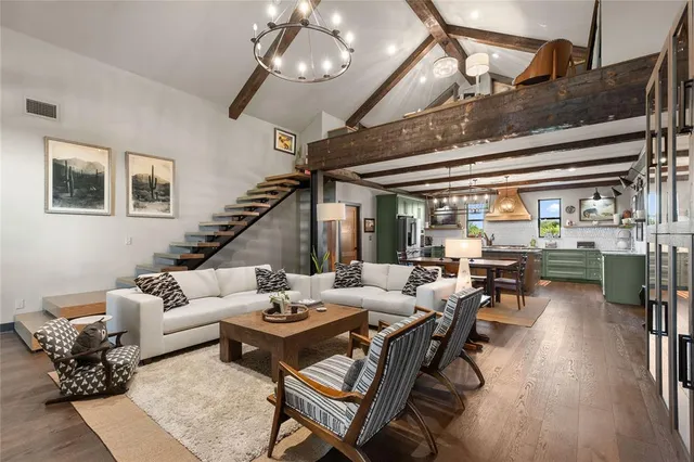 a kitchen with stainless steel appliances granite countertop a sink and cabinets