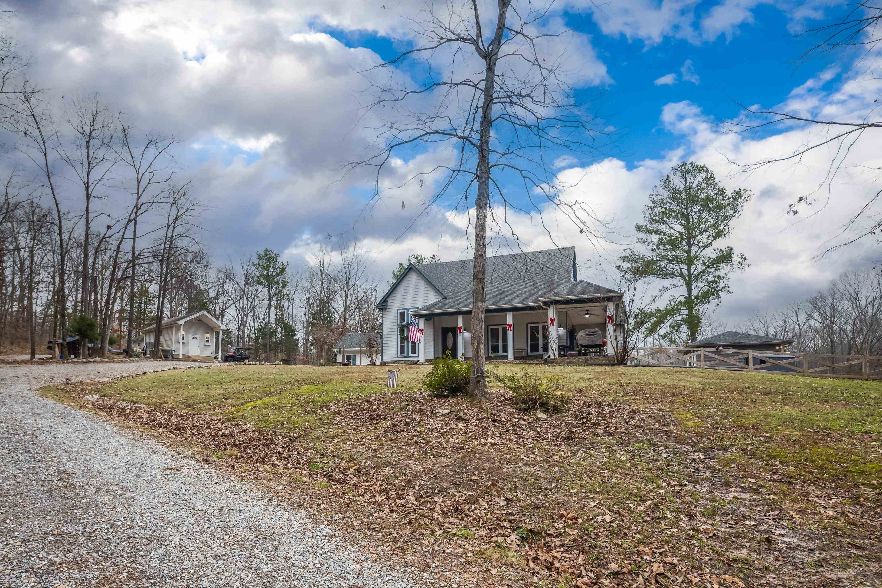 1755 Country Club Road Somerville, TN 38068 - Photo 12 of 40 View of front of house featuring a front lawn and gravel driveway