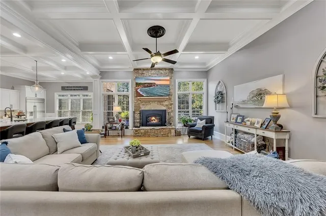 a view of a dining room with furniture a chandelier and wooden floor