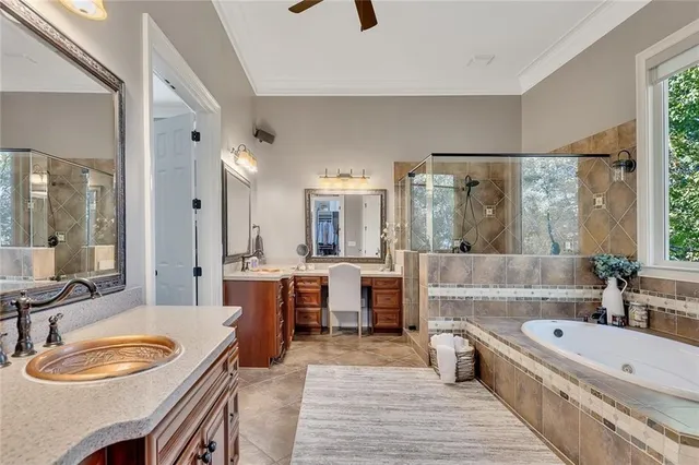 a bedroom with a bed a couch and a window