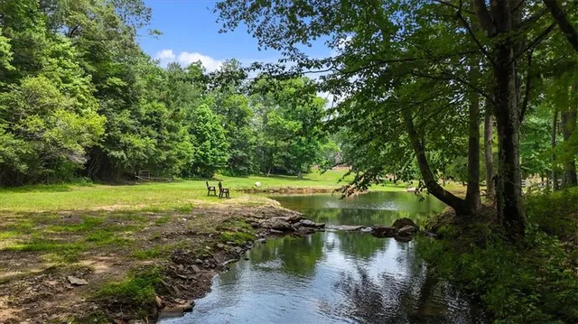a view of a lake with a yard