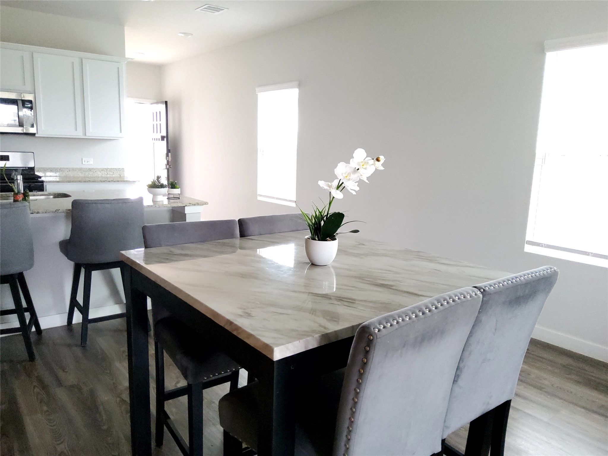 17359 King Eider Road Waller, TX 77484 - Photo 13 of 22 a dining room with furniture and wooden floor