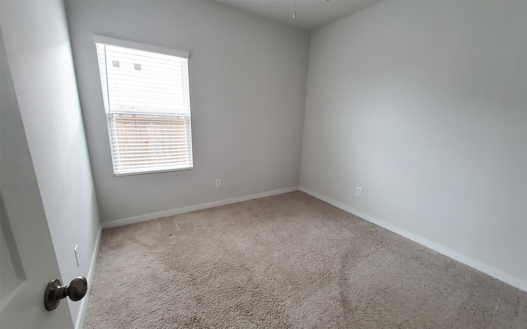 17359 King Eider Road Waller, TX 77484 - Photo 14 of 22 an empty room with a window