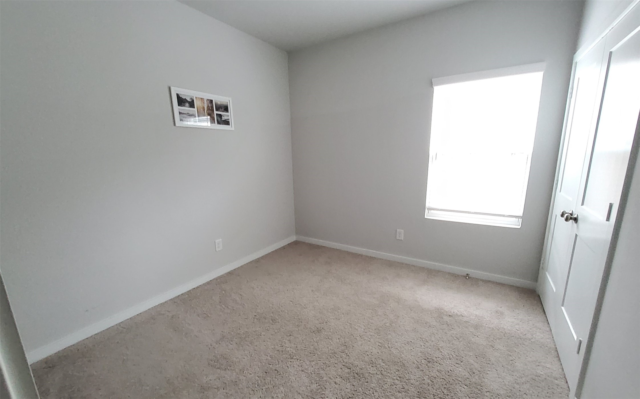 17359 King Eider Road Waller, TX 77484 - Photo 17 of 22 an empty room with a window