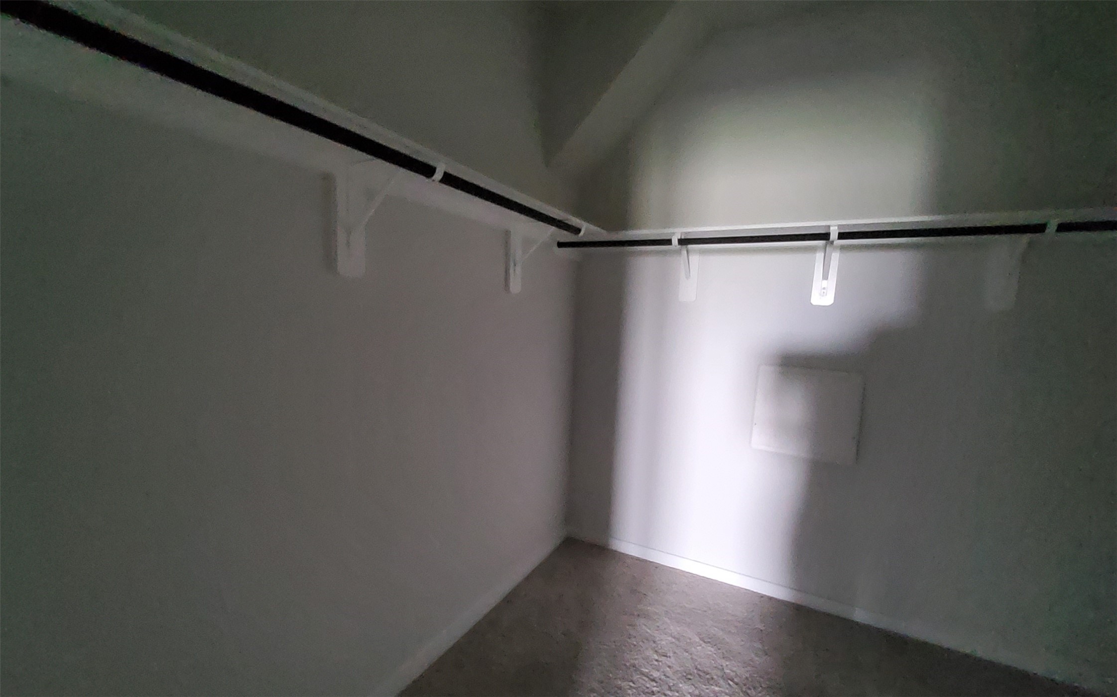 17359 King Eider Road Waller, TX 77484 - Photo 18 of 22 a view of a room with racks on the wall