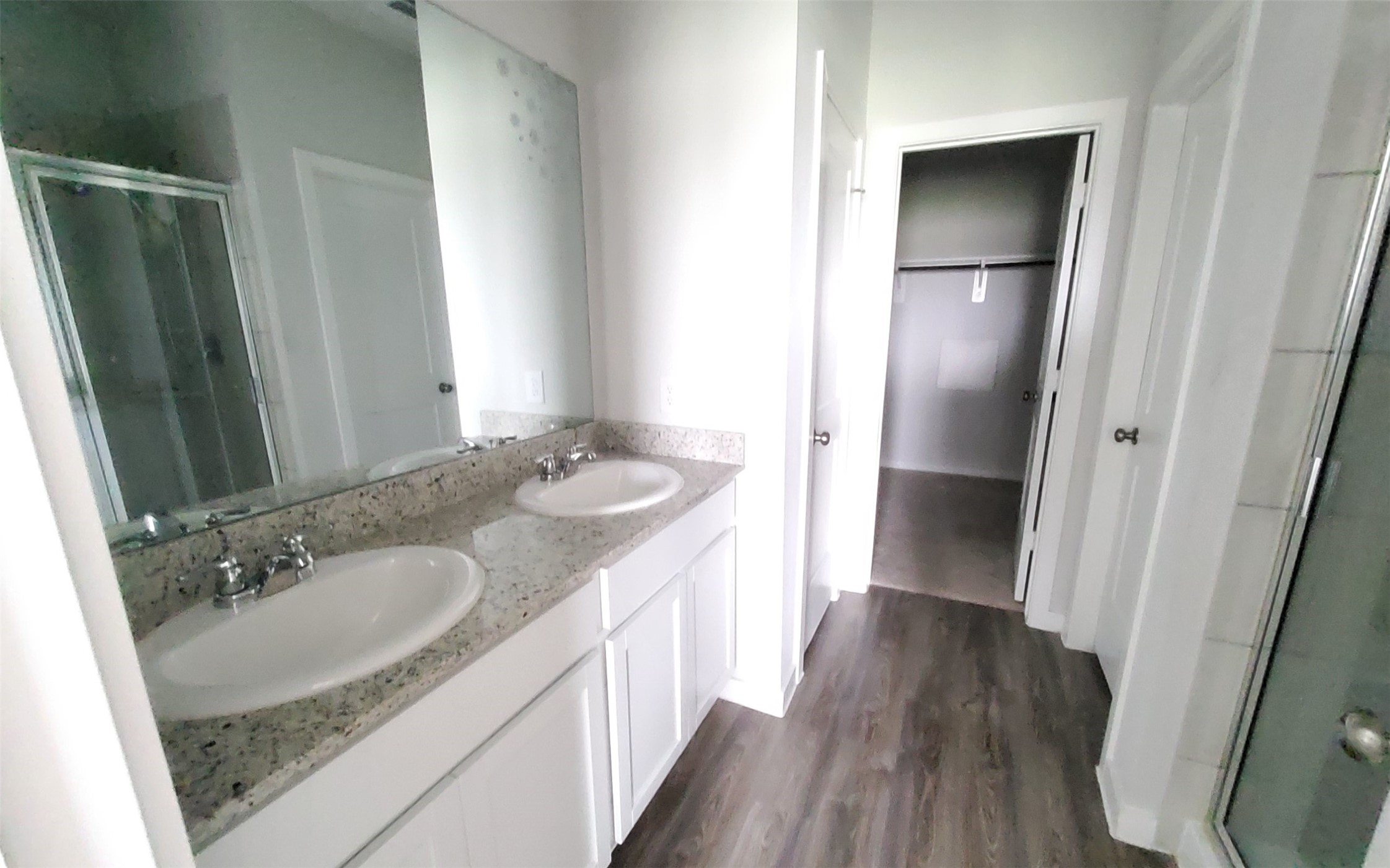 17359 King Eider Road Waller, TX 77484 - Photo 19 of 22 a bathroom with a sink and a mirror