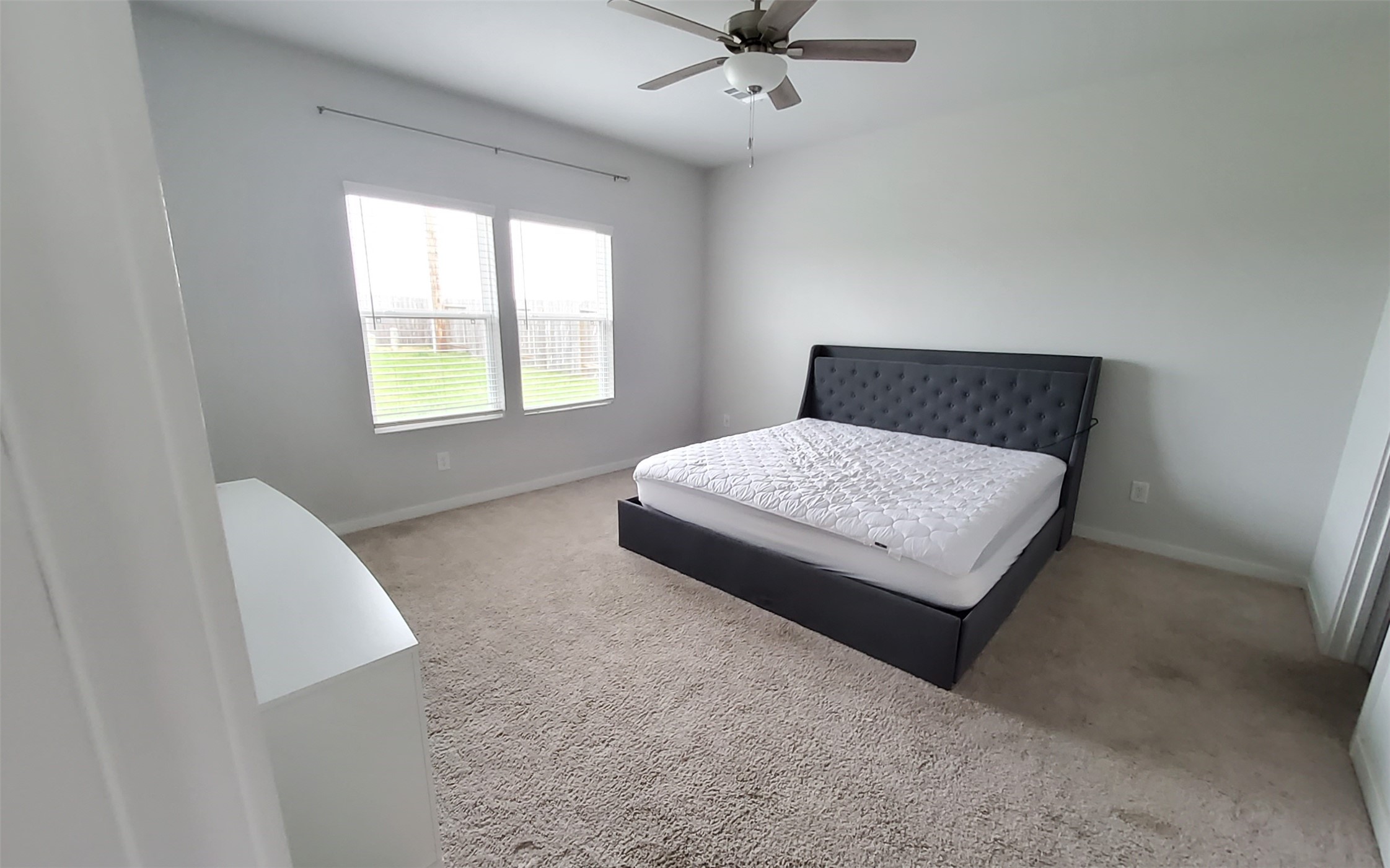 17359 King Eider Road Waller, TX 77484 - Photo 20 of 22 a bedroom with a bed and window