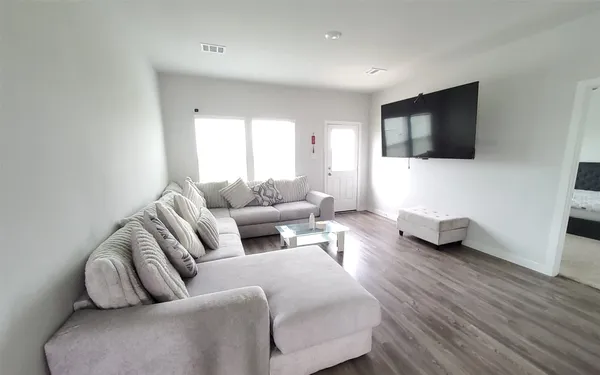 a kitchen with a sink and breakfast area
