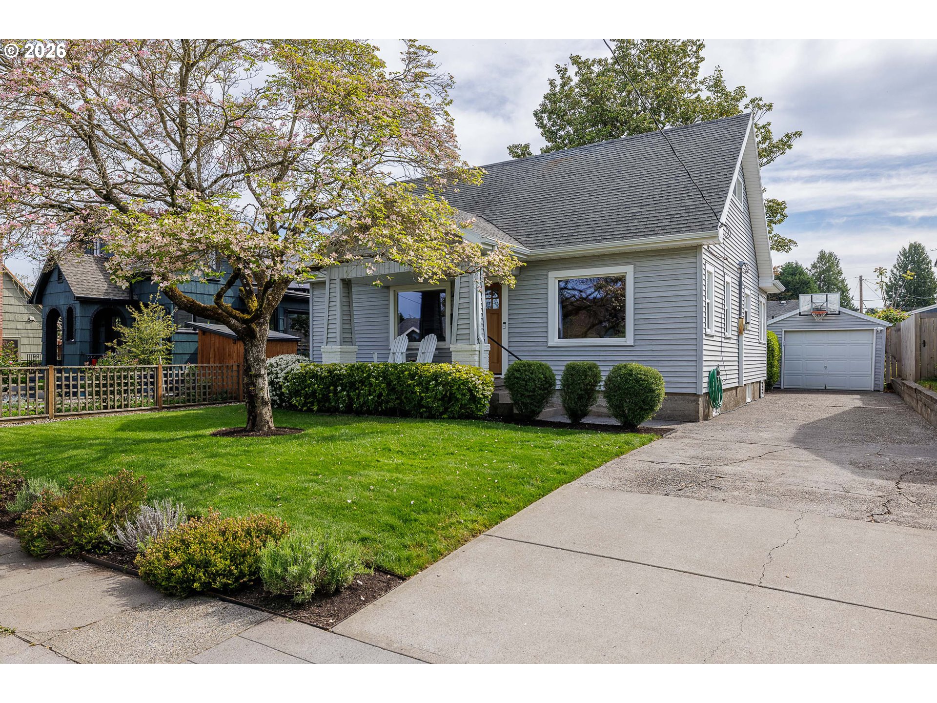 6128 North Denver Avenue Portland, OR 97217 - Photo 1 of 32 a front view of a house with a yard