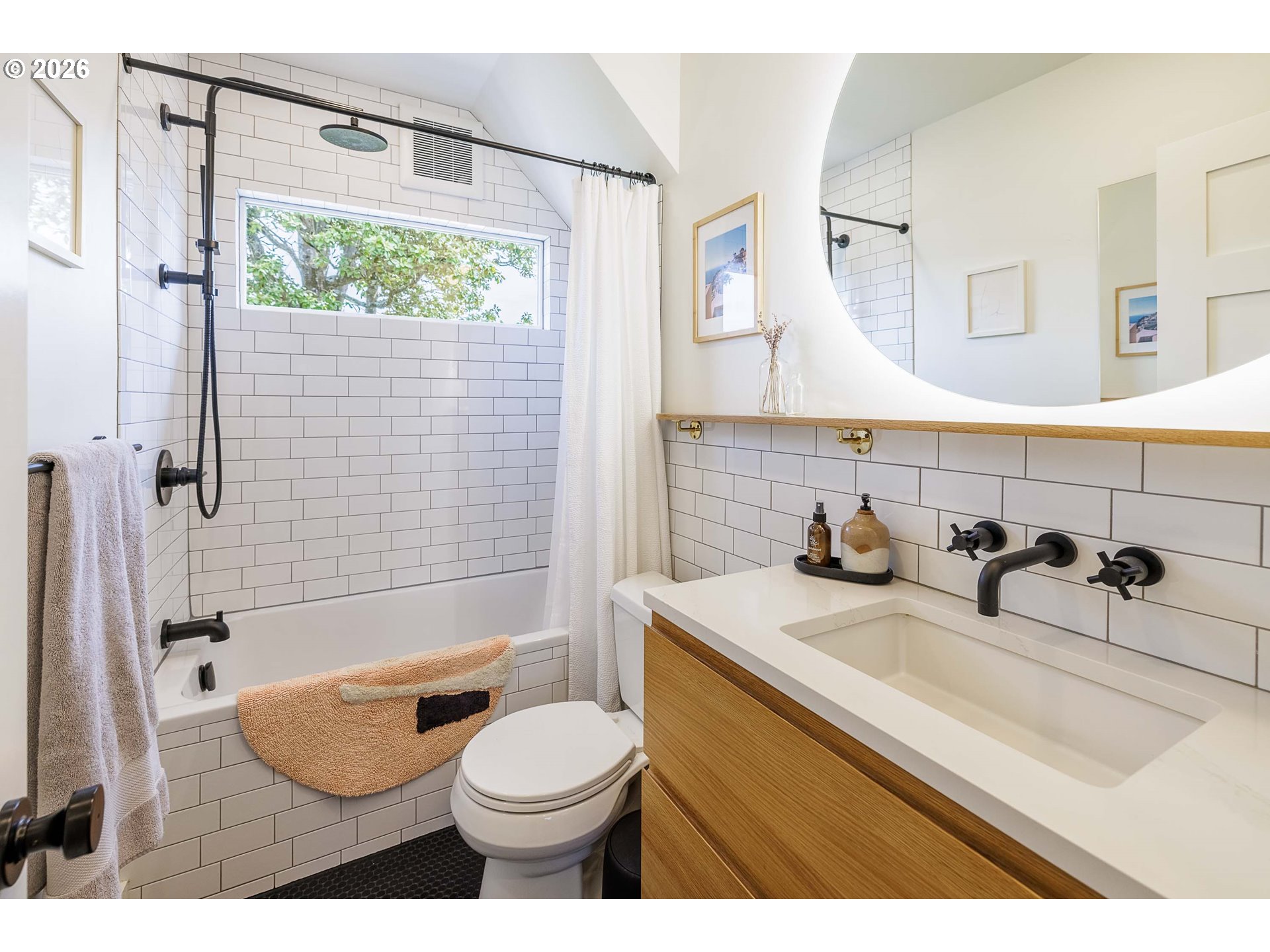 6128 North Denver Avenue Portland, OR 97217 - Photo 16 of 32 a bathroom with a sink toilet and shower